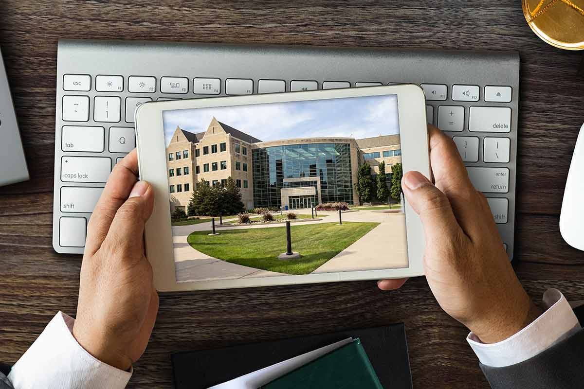 The Minneapolis School of Law campus is viewed through a handheld tablet.