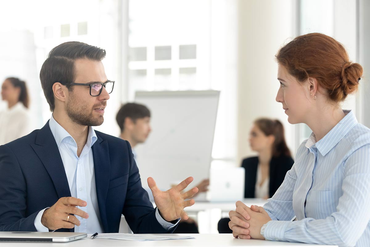 Employees engage in conversation