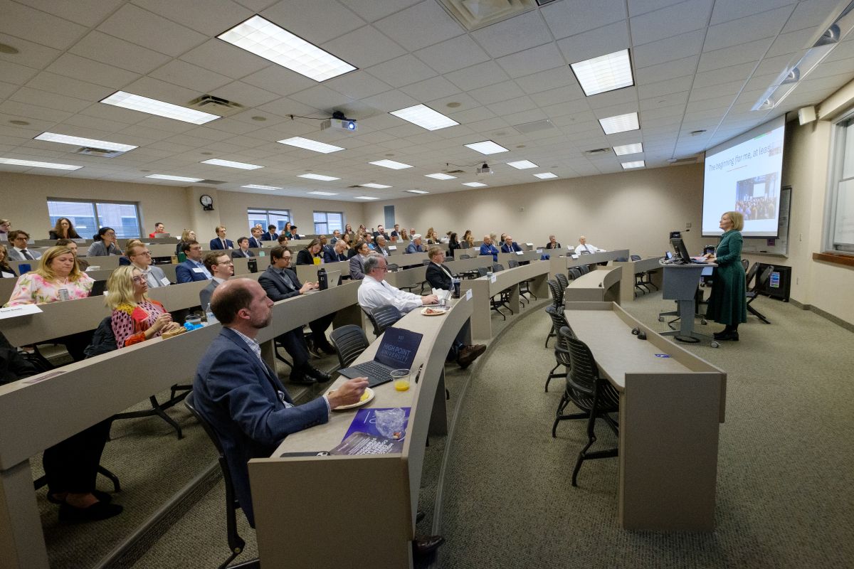 People in a classroom at a Holloran Center symposium