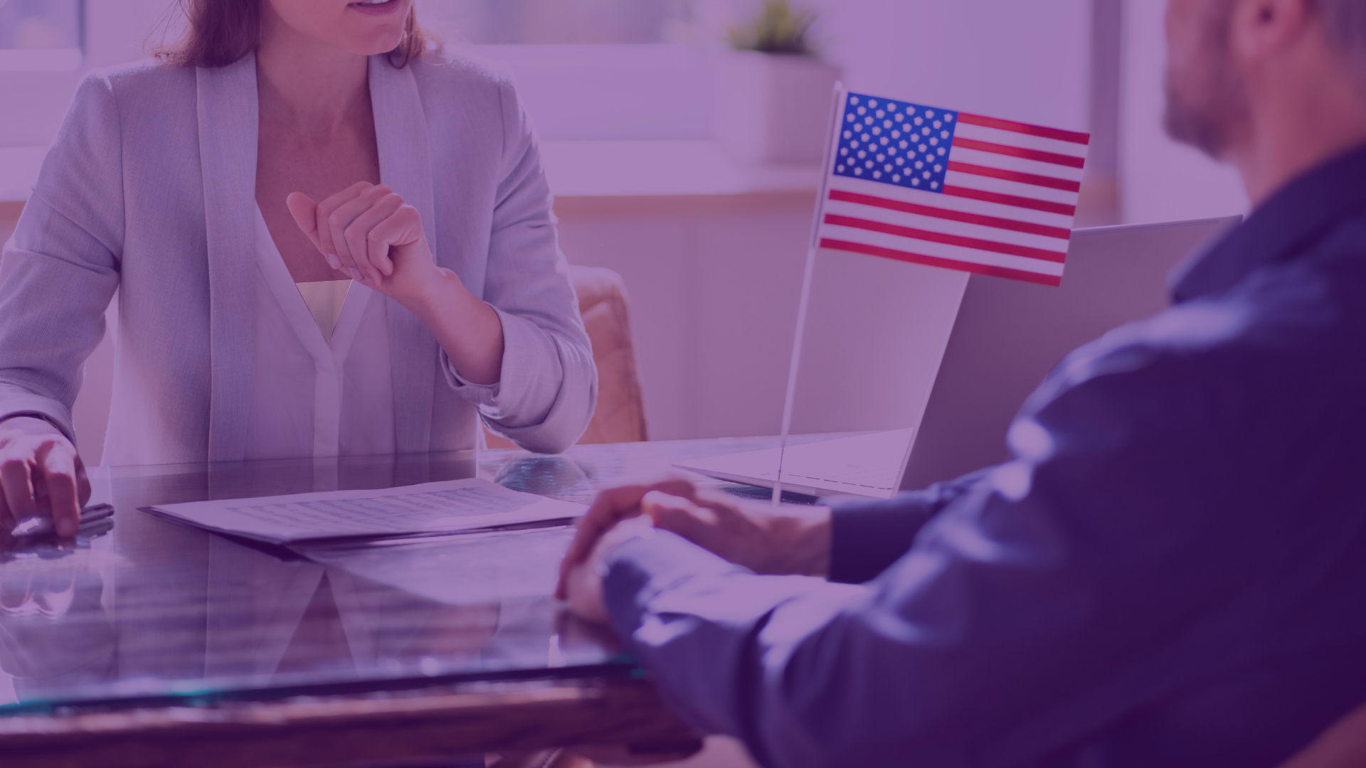 Two people in an office discussing citizenship or immigration