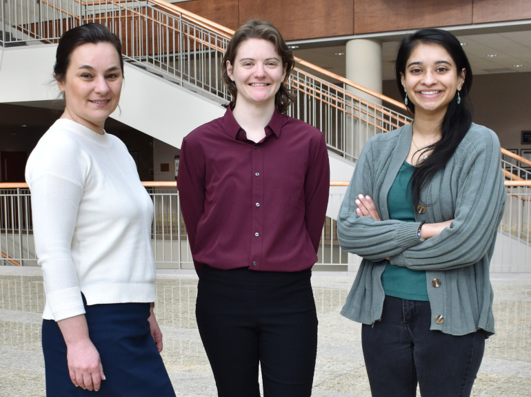 Three law students who worked in the immigration clinic