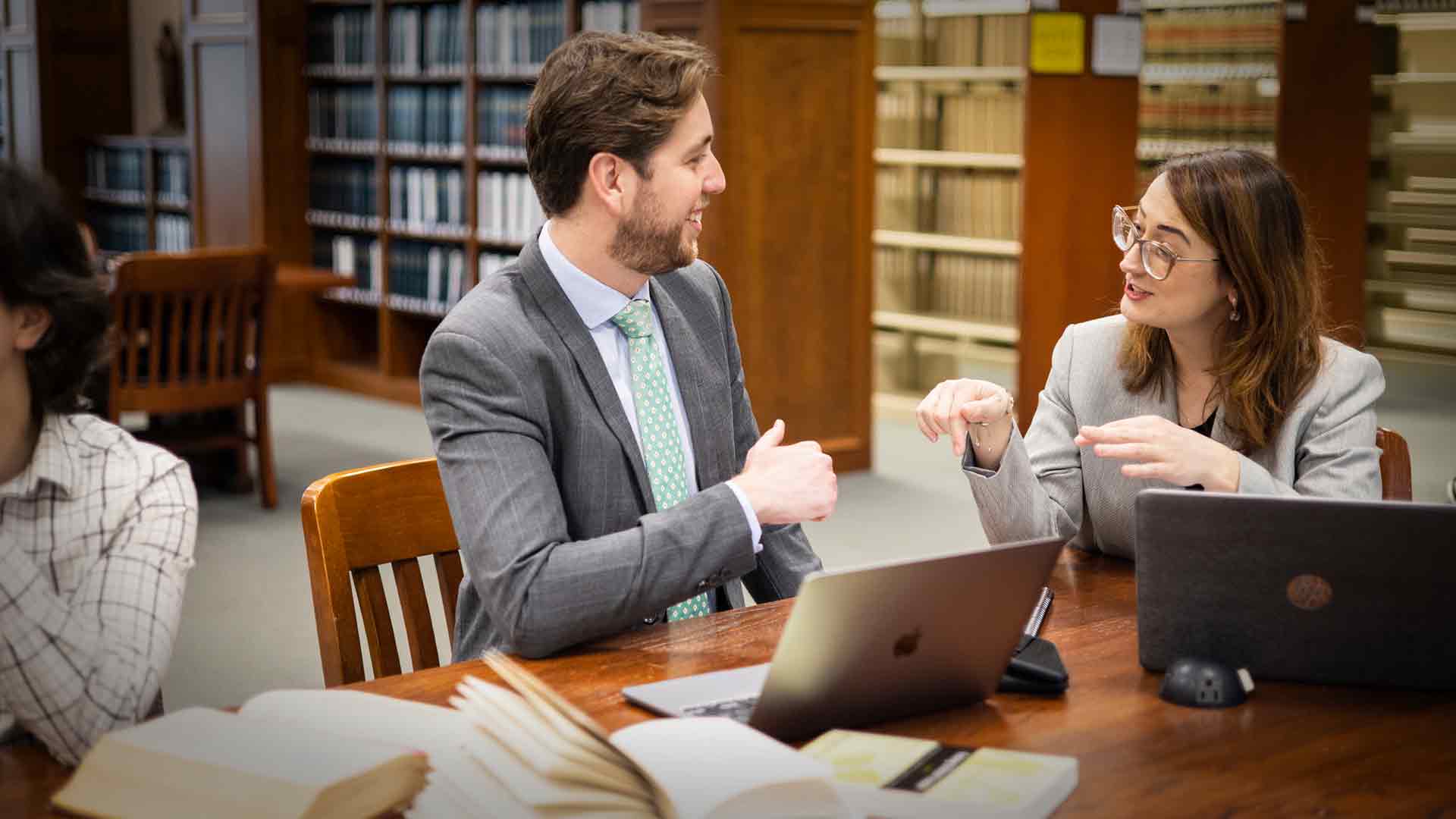 Students have discussion in law library