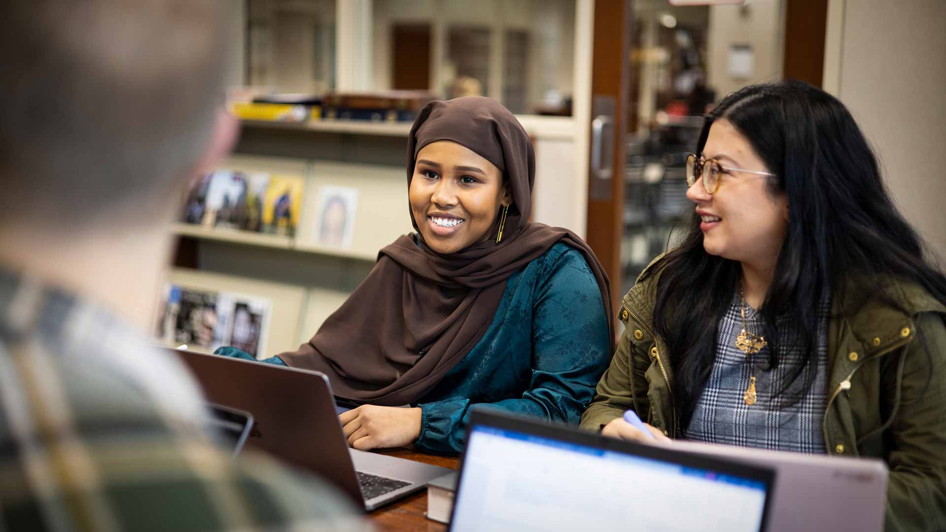 Students chat in library